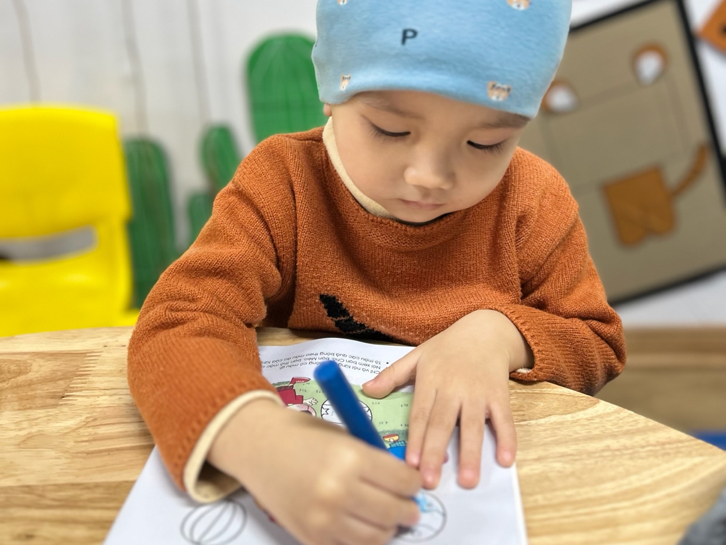 A child drawing on a paper

AI-generated content may be incorrect.
