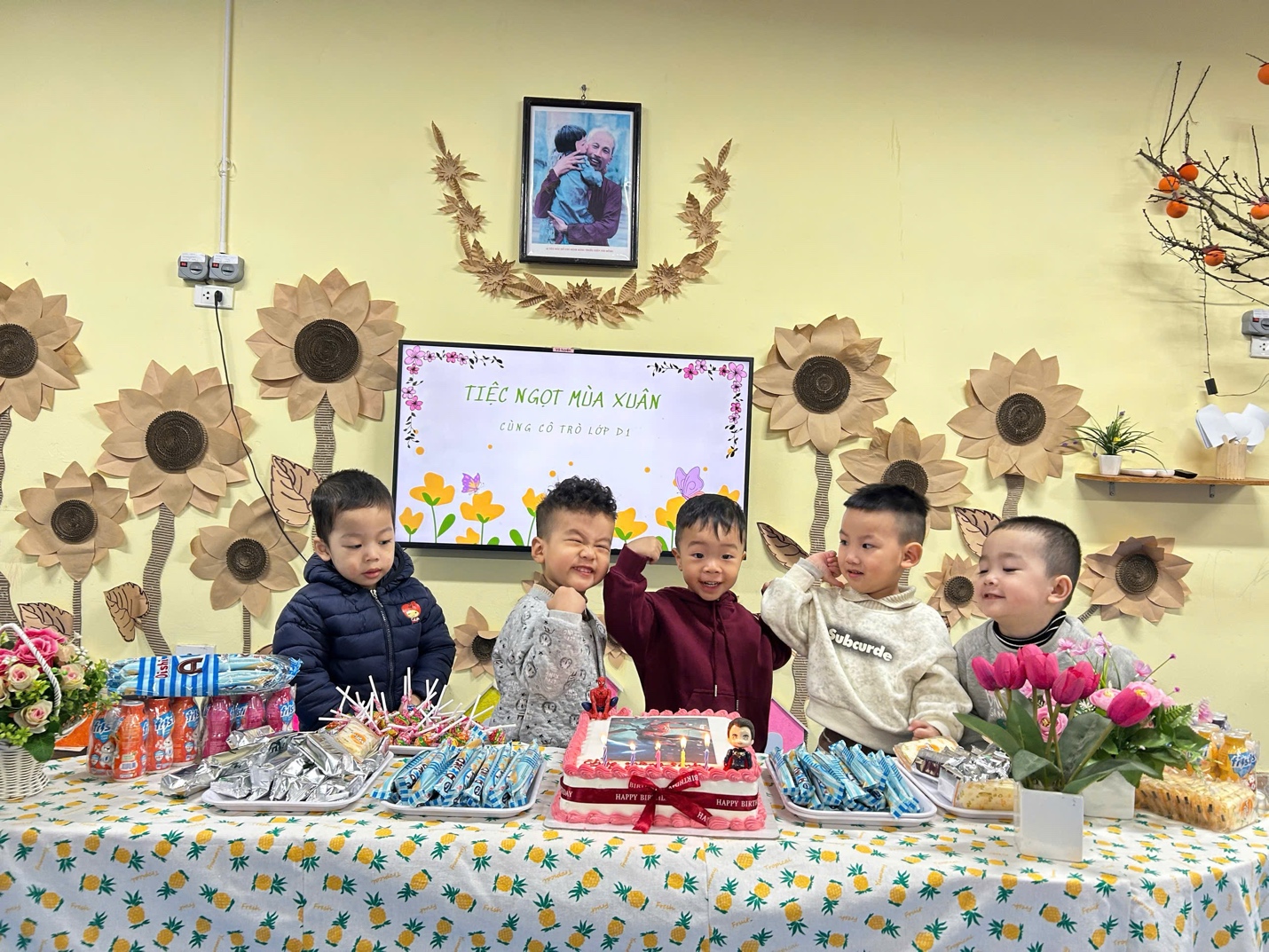 A group of kids sitting at a table with food and flowers

AI-generated content may be incorrect.