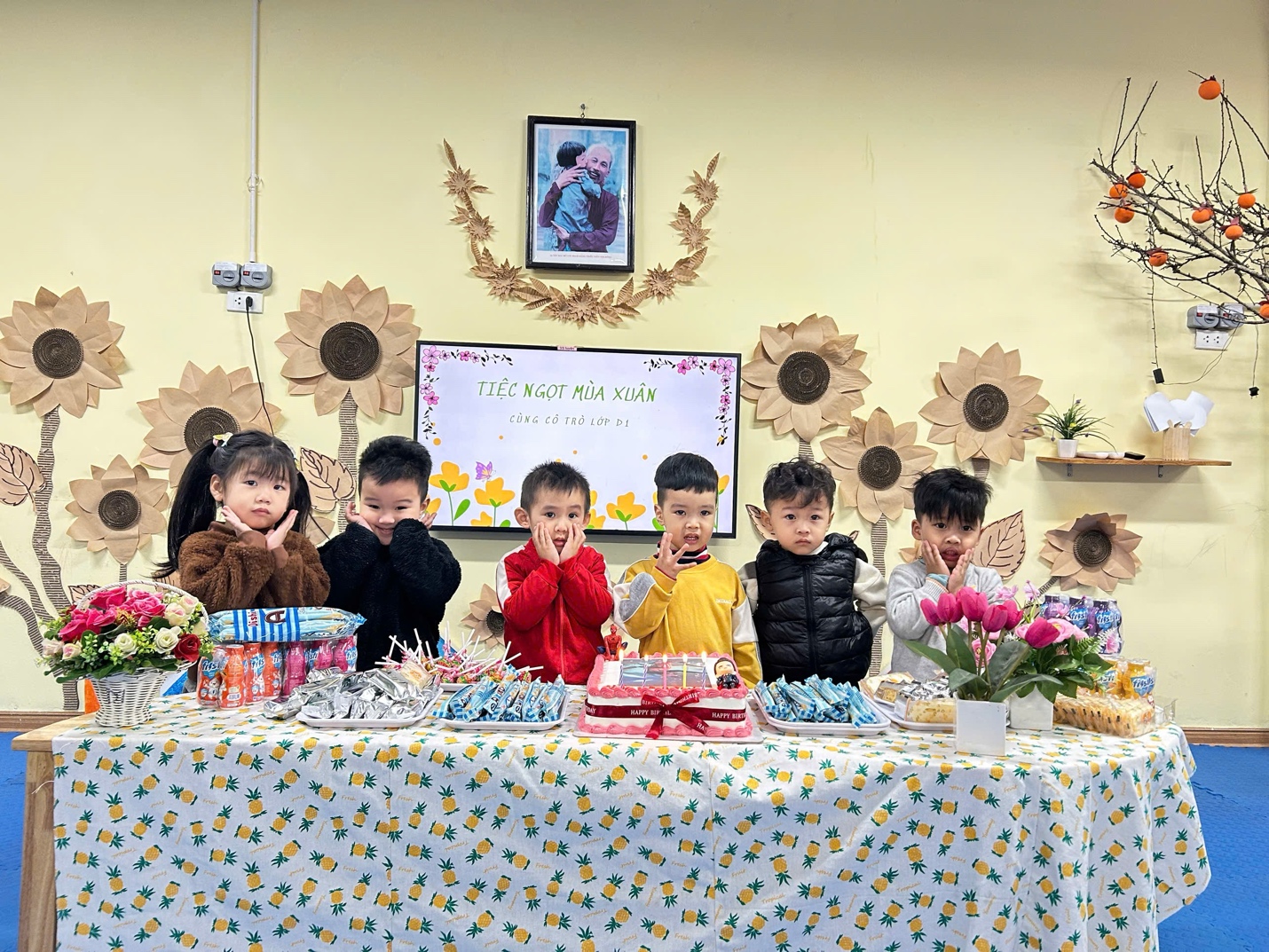 A group of children sitting at a table with food

AI-generated content may be incorrect.