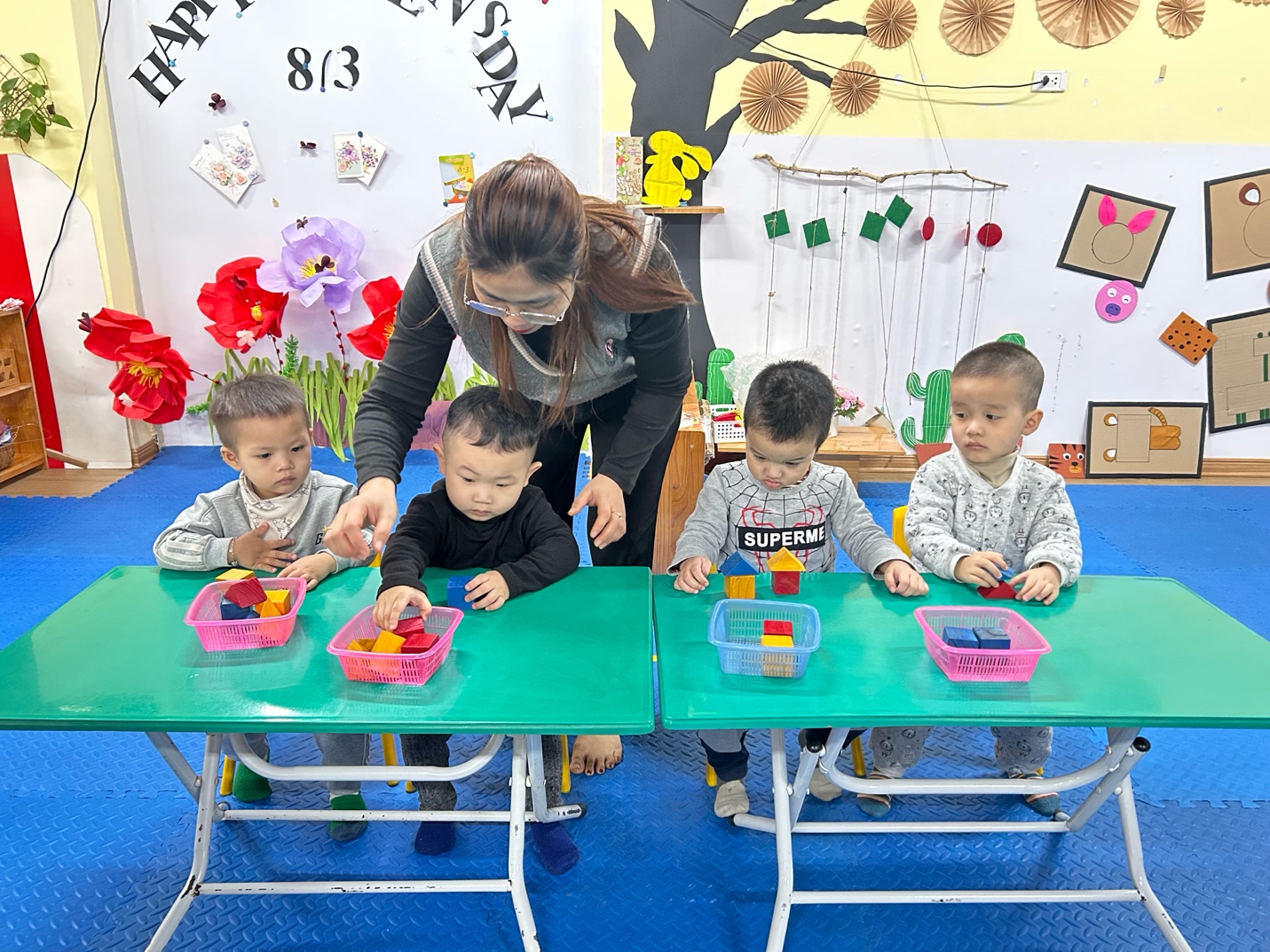 A group of children sitting at a table

AI-generated content may be incorrect.