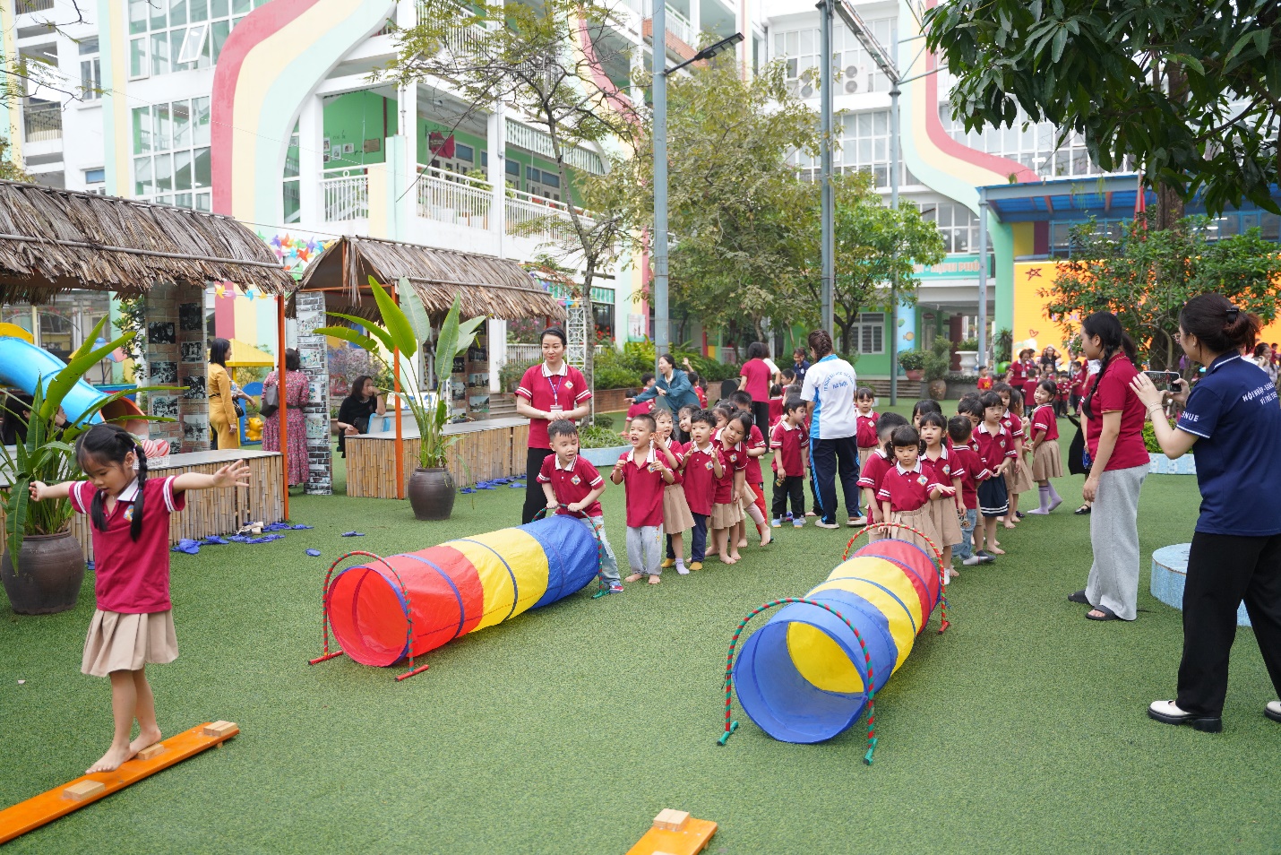 A group of children in red shirts

AI-generated content may be incorrect.
