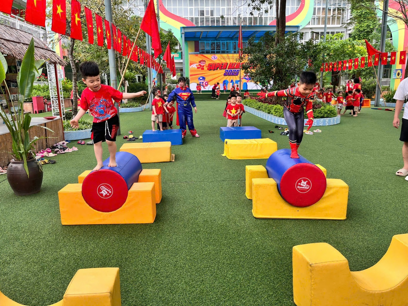 A group of kids jumping on a cylinder

AI-generated content may be incorrect.