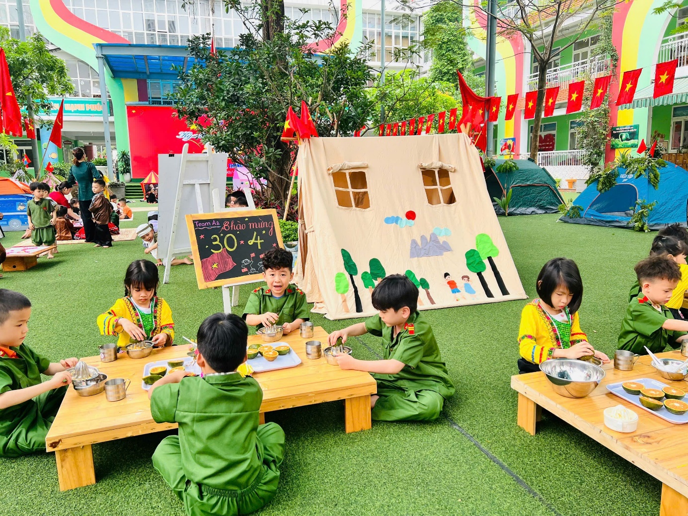 A group of kids sitting on grass outsideAI-generated content may be incorrect.