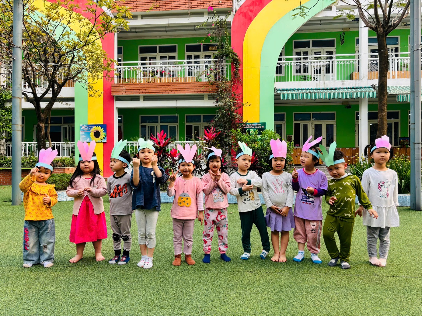 A group of children standing in a line in front of a building

AI-generated content may be incorrect.
