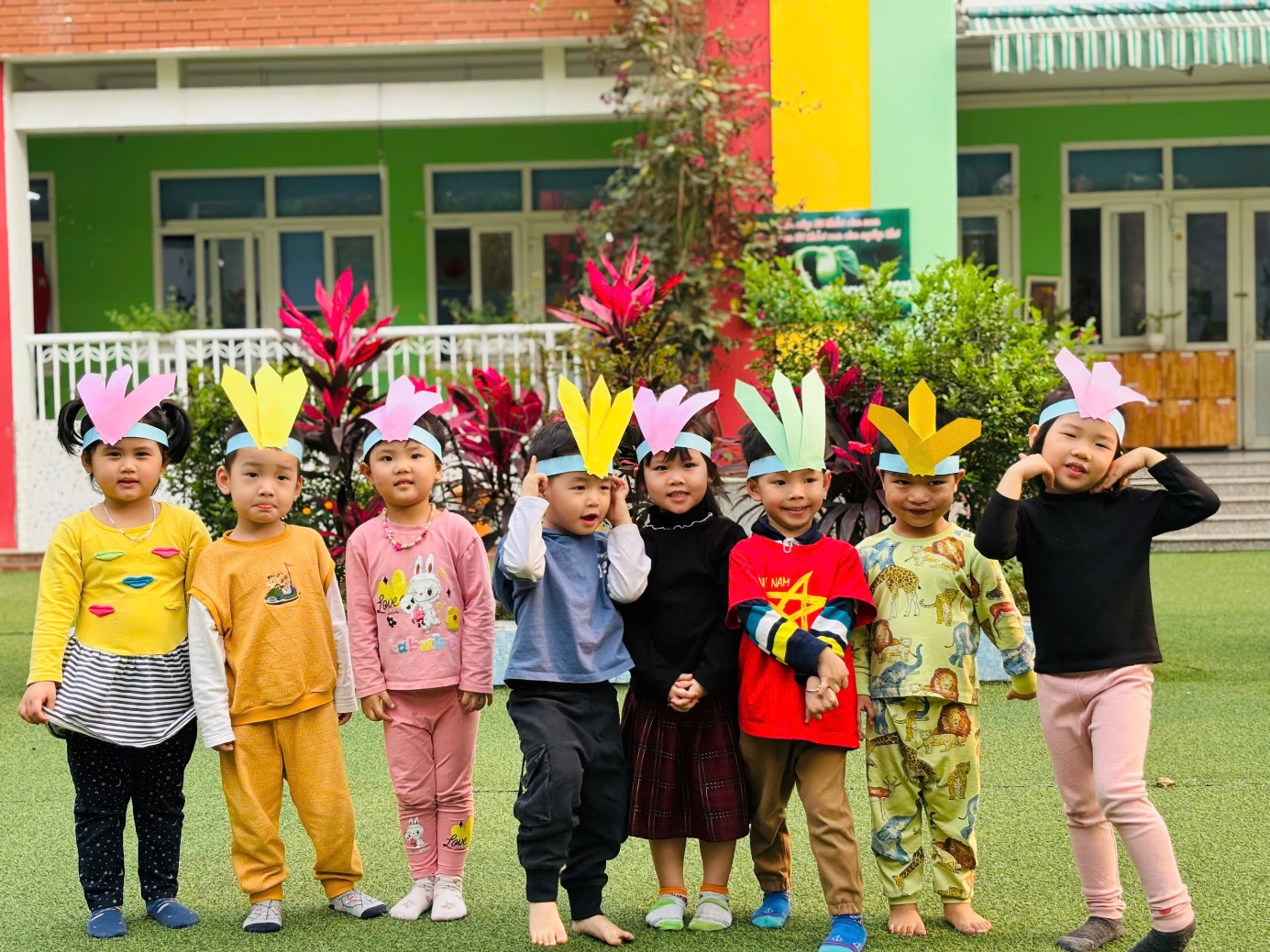 A group of children standing on grass

AI-generated content may be incorrect.
